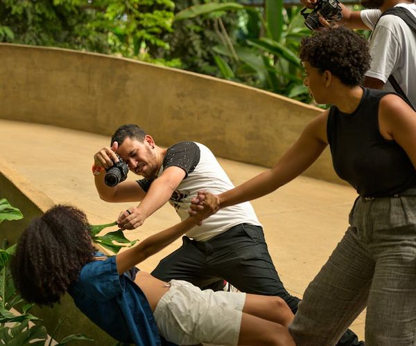 Diverse group of people smiling during a light group exercise session.